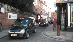 Shrewsbury Taxi Protest The rolling blockade makes its way along High Street. Photo: Julia Wenlock.