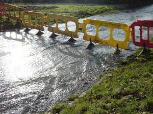 Boningale flooding Water pours from the burst main. Photo: Tom Stokes - *beacon.