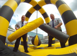 Tom Charles and charity event organiser John Connaughton, of RMP Events, check out the bouncy castle on its way to a school event in the Isle of Man. Tom Charles and charity event organiser John Connaughton, of RMP Events, check out the bouncy castle on its way to a school event in the Isle of Man.