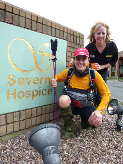 Lynette Payne watches on as Andrew Brown limbers up in his desert running kit ready for his Saharan  adventure.