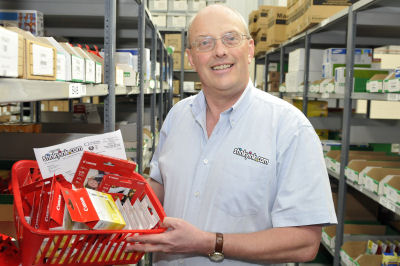 John Sollars packing orders.