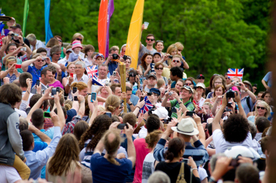 People photograph the torch as it passes over the Iron Bridge. Photo: Steve Elliott. People photograph the torch as it passes over the Iron Bridge. Photo: Steve Elliott.