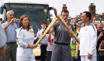 Olympic Torch kiss on the English Bridge in Shrewsbury. Olympic Torch kiss on the English Bridge in Shrewsbury.