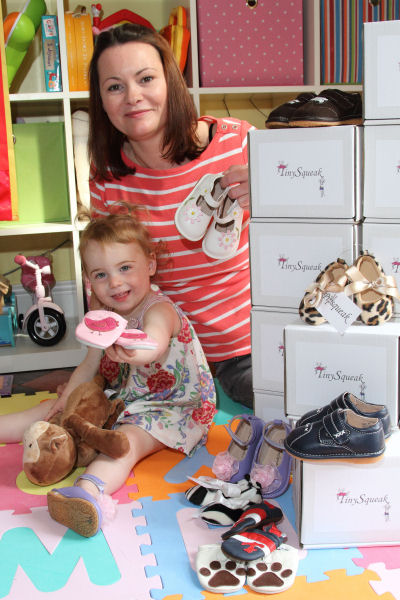 Abigail Barker and daughter Sienna with the Tiny Squeak shoes. Abigail Barker and daughter Sienna with the Tiny Squeak shoes.