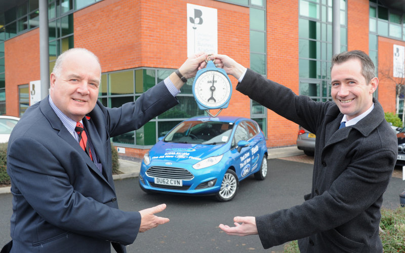 ’Weighing up’ the sponsored slim target, are Steve Owen (LEFT) and Tony Mellish, at The Business Academy, Shrewsbury.