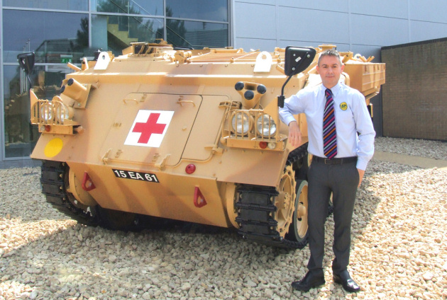 Steve Bray with the Armoured Ambulance used to assist wounded soldiers in Iraq which is now proudly parked outside the new £2 million HQ for SP Services (UK) in Telford.