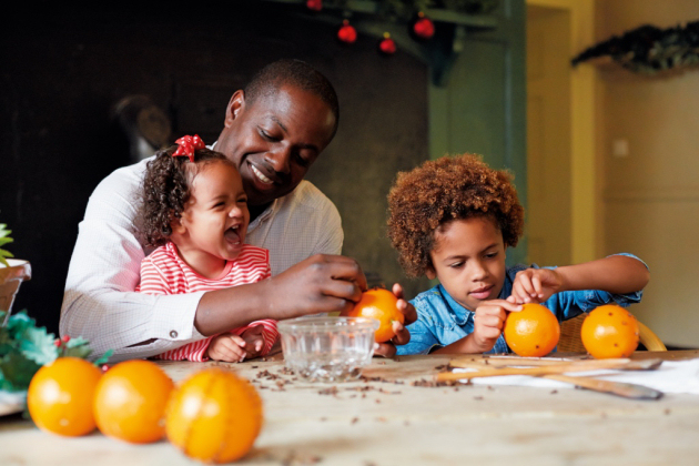 A family make pomanders at Attingham Park. Photo: National Trust Images.