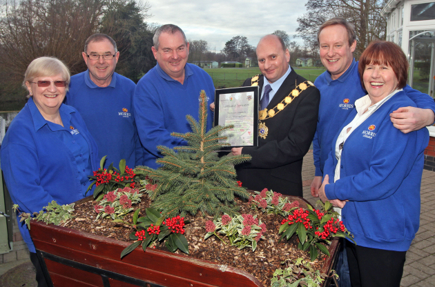 Oxon Hall Touring Park manager Clive Jones receives the certificate from the Mayor Councillor Jon Tandy watched by (from left) assistant managers Judith and Gareth Jones, Morris Leisure’s managing director Edward Goddard and manager Virginia Jones.