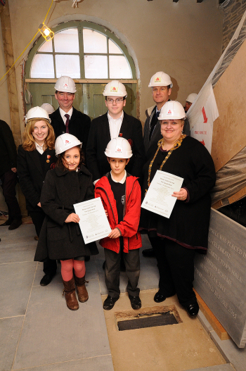 Lucy Burns (Community College deputy head girl), Andrew Barker (Bishop's Castle Primary School head), Jonathan Rees (Community College deputy head boy), and Alan Doust (Community College head). Front row from left: Lucy Cooke and Edward Barnes (both primary school pupils), and Karen Bavastock (town mayor).