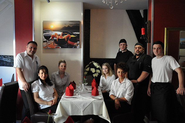 Zeki and Hatice Celebi (far left), restaurant owners, welcome visitors to the Steak & Grill Mediterranean Restaurant with (l to r) Kirsty Peters, Sophie Rowland and Kody Goodall (waitresses), Andy Steinert (sous chef), Alessandro Degiorgio (Italian head chef) and Ashley Wear (kitchen porter).