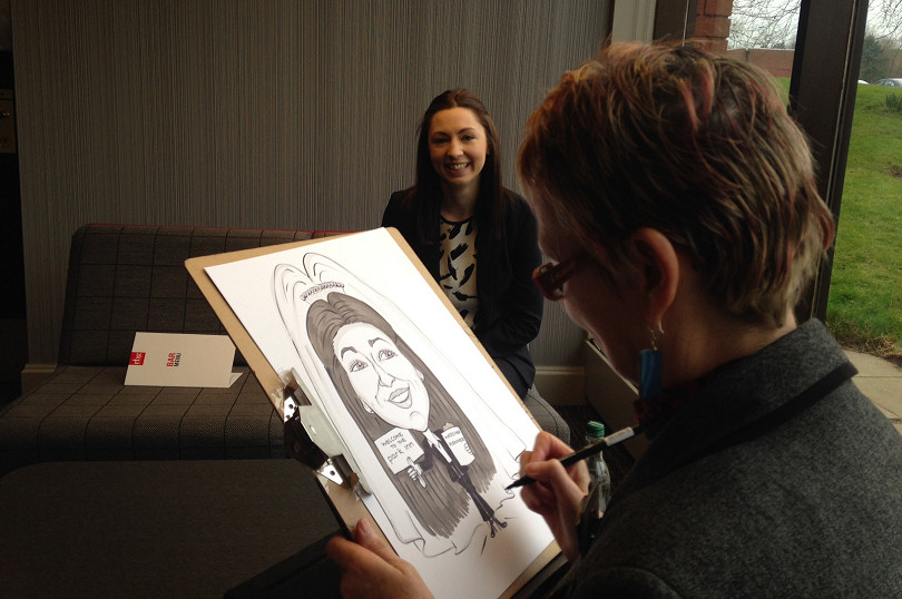 Rebecca Dawson, events coordinator, having her caricature done at a recent wedding fair