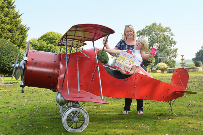 Operations Director Sophia Knowles is pictured handing over the latest visitor donations to Hope House Major Gifts Manager Vanessa Thomas