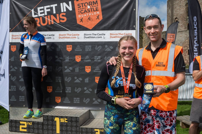 Pictured, left to right Teme Leisure Tri Club Shannon Gilbert on podium and Sister, also Teme Leisure Tri Club member, Eilish Gilbert with race director Dermott Hayes. Eilish was first in her category (females 16-24) and her sister was runner up. Photo: Darren Musgrove