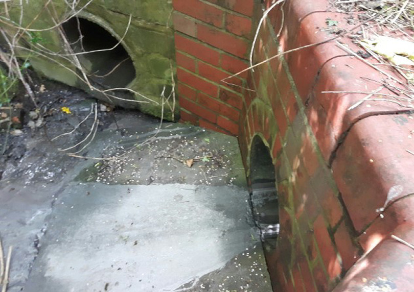 Concrete can be seen coming from an outlet