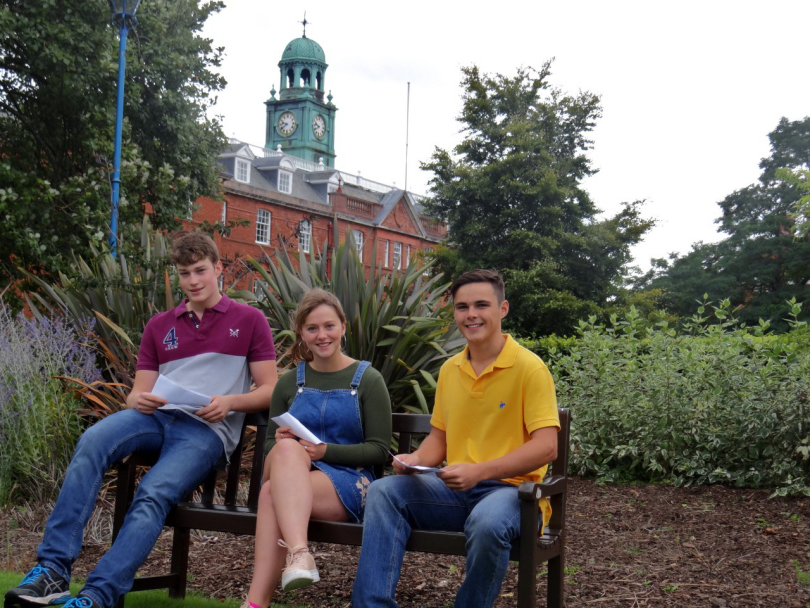 Adam Pattenden, Sophia Breese and Alexander Davies open their results at Shrewsbury School