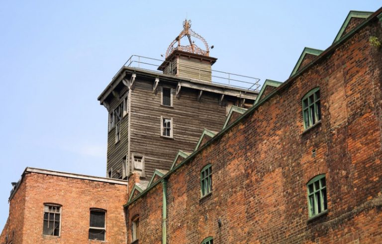 Exterior view of Shrewsbury Flaxmill Maltings looking up at the turret. Photo: Historic England