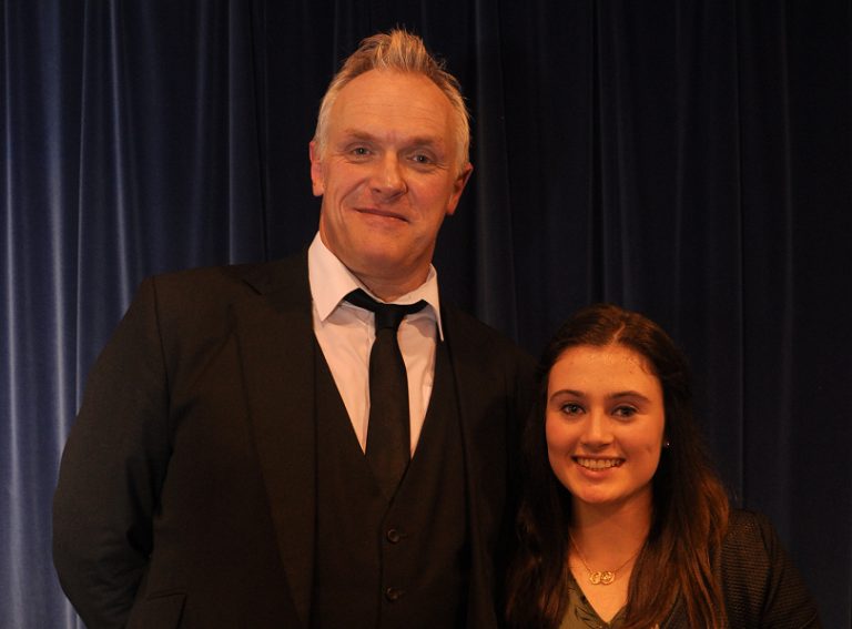 Greg Davies surprises students at his former school as they celebrate success