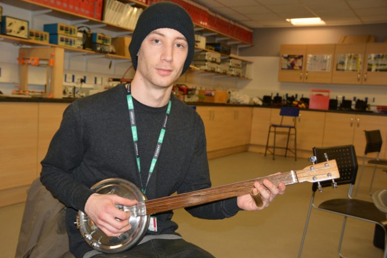 Shrewsbury student turns hubcaps into unique guitars