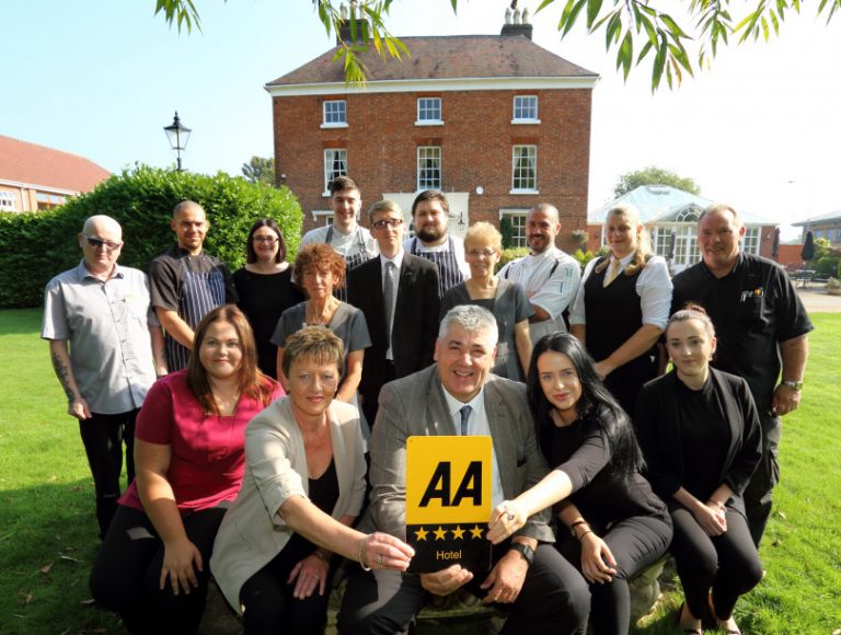 The team at Hadley Park House Hotel, Telford celebrating their four-star award