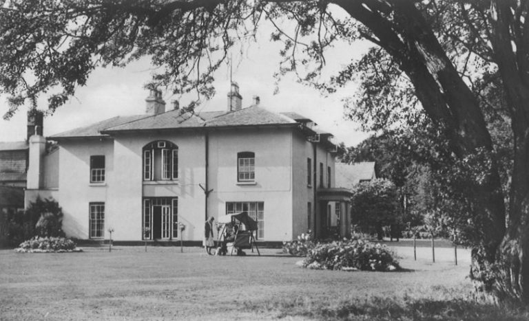 An early photograph of the college's house and gardens