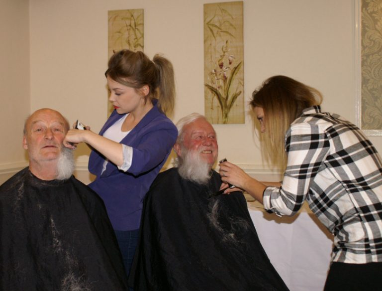 Tony Cook and Peter Love of Shrewsbury Severn Rotary Club have their beards shaved for charity