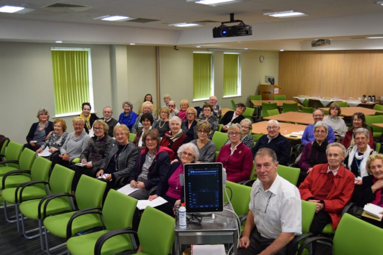 Consultant Mr Cormac Kelly with the new scanner, surrounded by members of the hospital's League of Friends