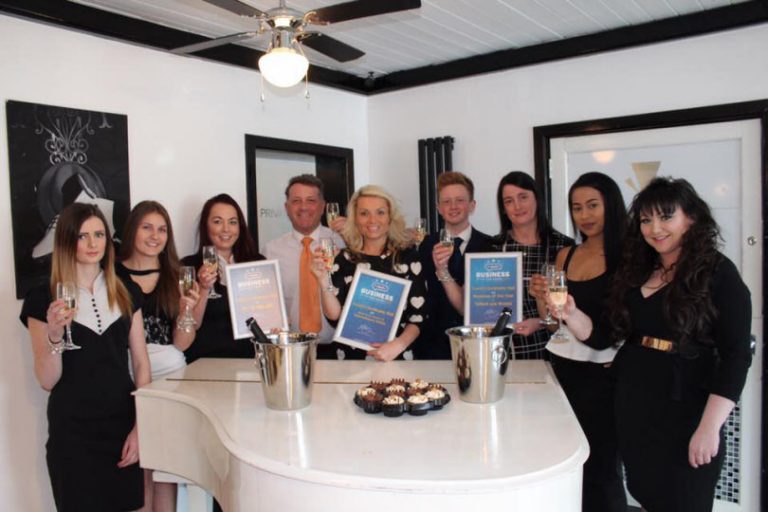 Adrian and Nicola Casey with staff celebrating