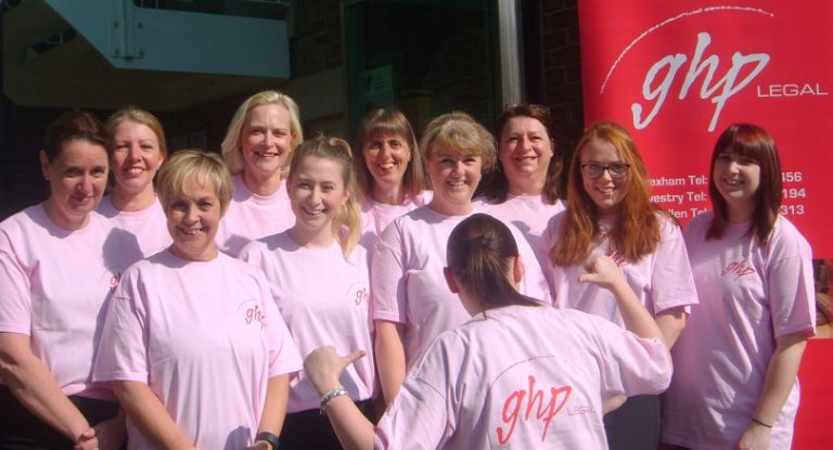 Legal staff team up outside office to support colleague in Race for Life