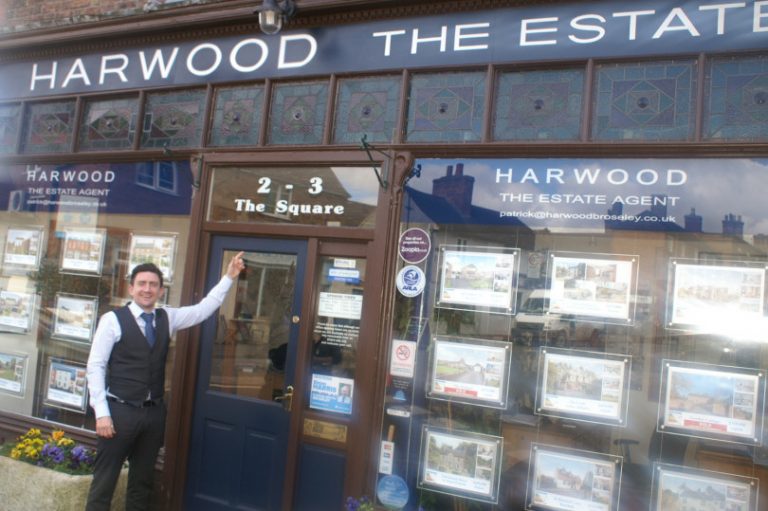 Patrick points to the office which he has purchased