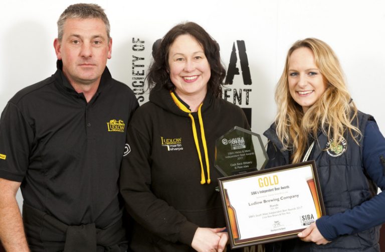 Chris Davies and Alison Walters (from Ludlow Brewery) being presented the Gold award by Emily Powell-Tuck from Charles Faram