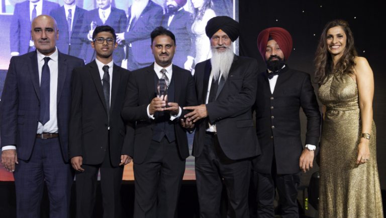 John Mehtam from Martin-Kaye Solicitors (centre) receives his award at the ceremony with, from left, Jas Mandair (KTV), Arran Mehtam, Amrik Singh Gill (KTV), Jagit Singh Bassi (KTV), and Sameena Ali Khan (Central TV)