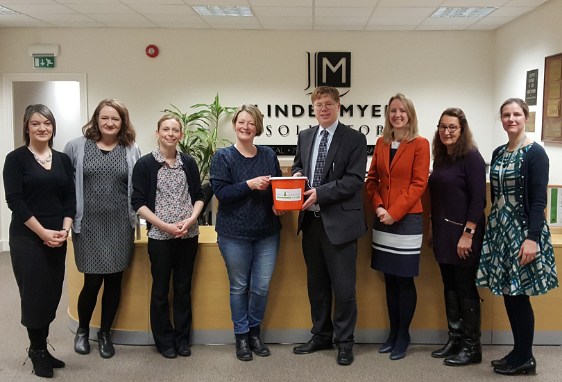 Linder Myers staff members with Sally Johnson of the Harry Johnson Trust