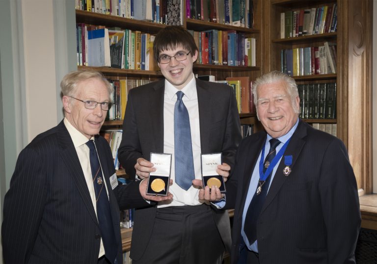 Chris Lewis (centre) with his two medals presented by former ATT presidents Mr Peter Gravestock and Mr John Kimmer (right)