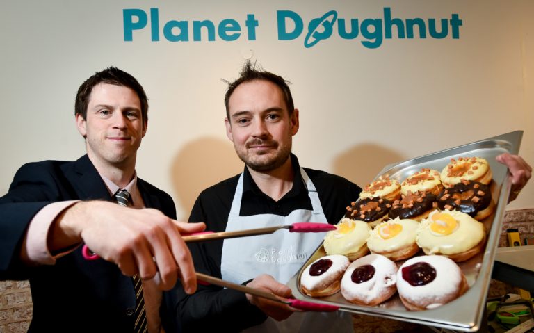 Checking out the doughnuts is Adam Davies of FBC Manby Bowdler and Duncan McGregor, Planet Doughnut