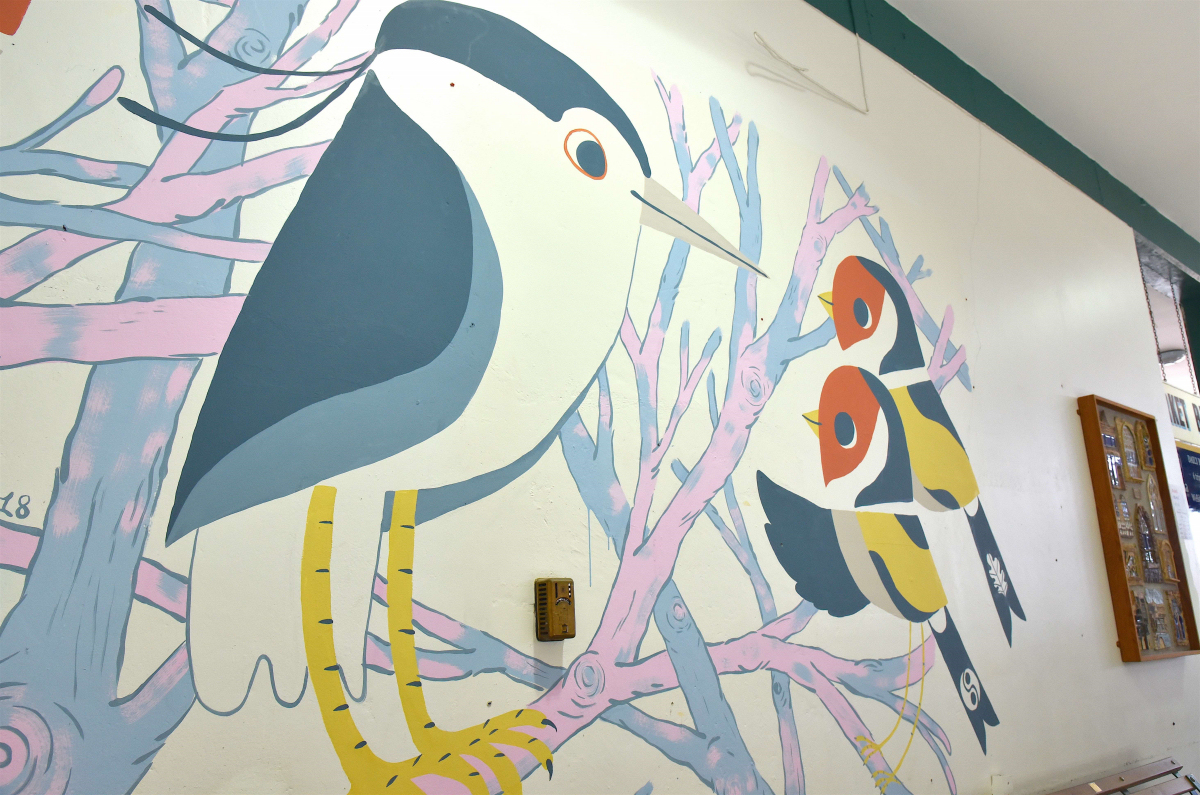 The mural celebrates the story of a rare heron that famously made its home in the town’s Quarry Park Dingle for several months