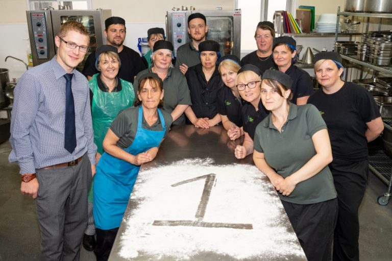 RJAH’s kitchen staff celebrating the quality of their food being rated as best in the country