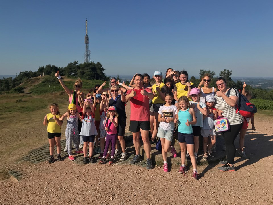 Lex at the top of the Wrekin with members of Girlguiding Shropshire, Clare and Kate from Macmillan Cancer Support