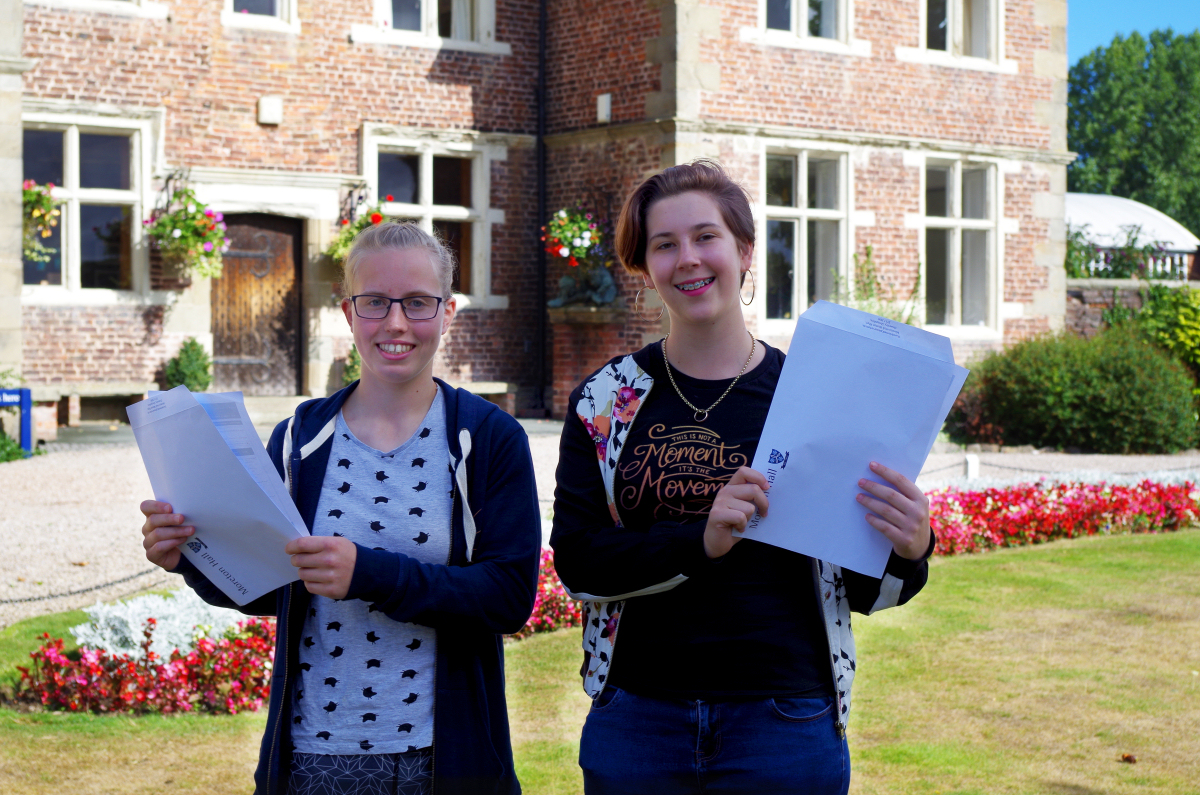 Moreton Hall students Holly Jones who achieved 2 A*s and 1 A and Georgina Lang who achieved four A*s