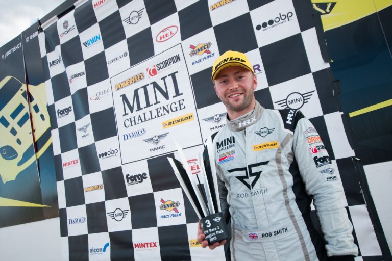 Rob Smith on the podium following the final race of the season at Donington Park Grand Prix Circuit. Photo: Mark Campbell/CarSceneUK