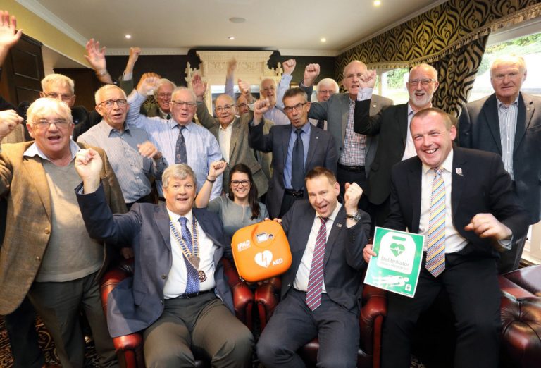Wellington Rotarians give a big cheer after helping to buy a defibrillator for hikers and hotel guests pictured with (front)Wellington Rotary president Peter Williams, hotel general manager Wayne Jenson and Paul Watts, of SP Services, at the Buckatree Hall Hotel at the foot of The Wrekin