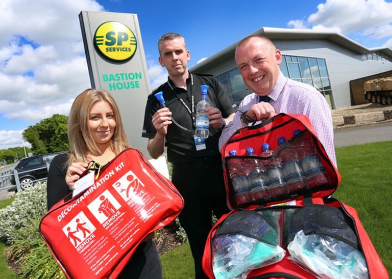 Charlotte Crick from SP Services Business Development team with Sergeant Scott Howard and Paul Watts, head of International Business Development at SP Services with the “tailor made” decontamination kit