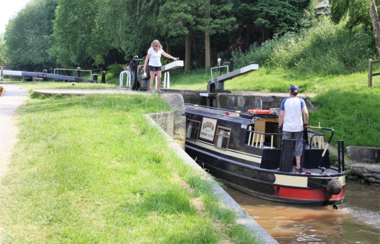 Shropshire Union Canal boat using lock at Audlem