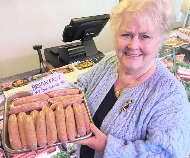 Sylvia Davies of Donnington with her winning sausage at the G.N. Badley & Sons store in Trench; and Sylvia’s English breakfast sausage cooked up at the butcher’s store