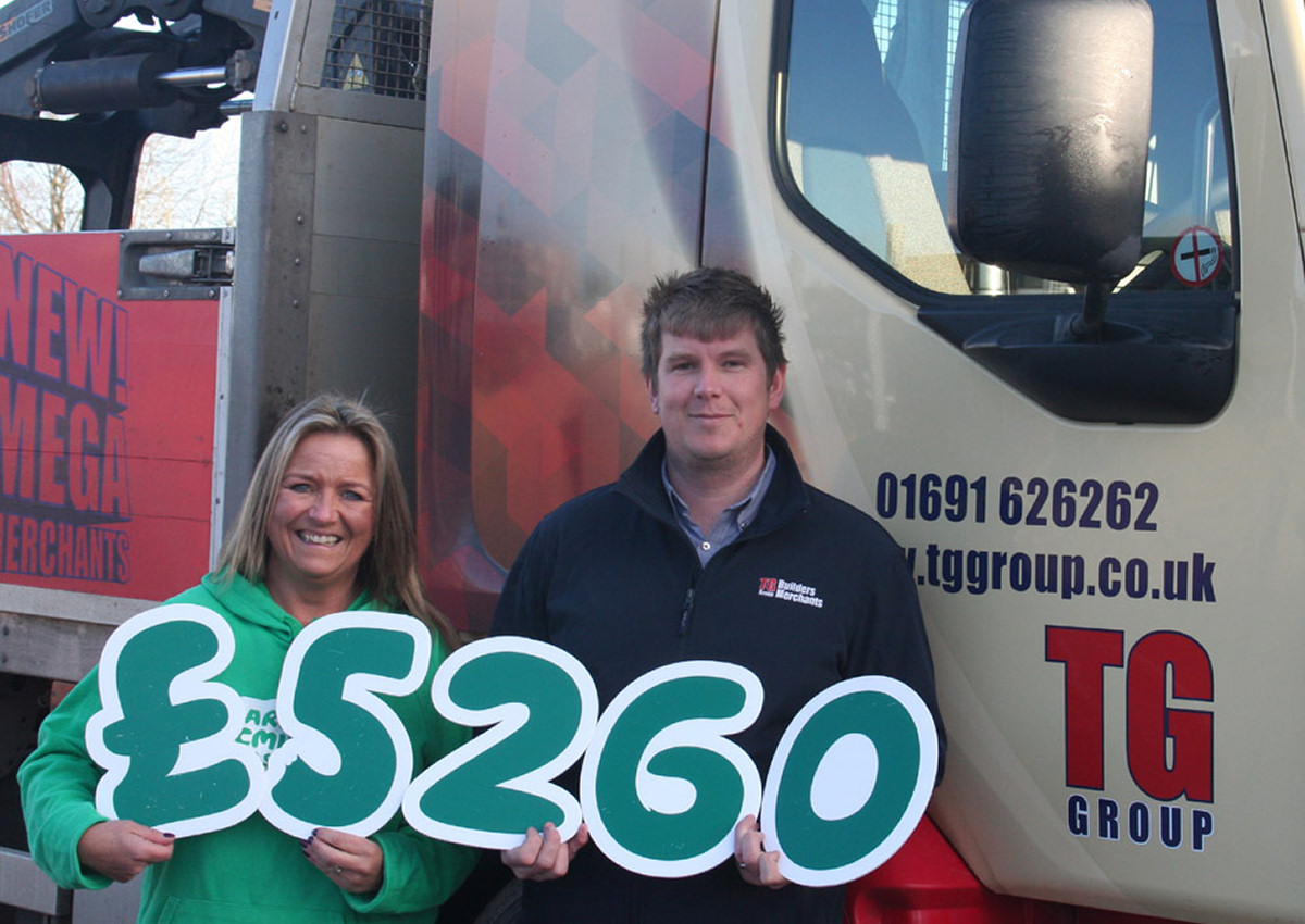 Kate Thomas from Macmillan Cancer Support and Paul Morris, branch manager at TG Builders’ Merchants Oswestry