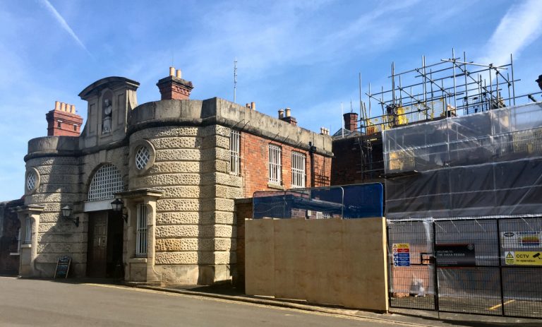 Development work has begun at Shrewsbury Prison, photo of outside with scaffolding erected.