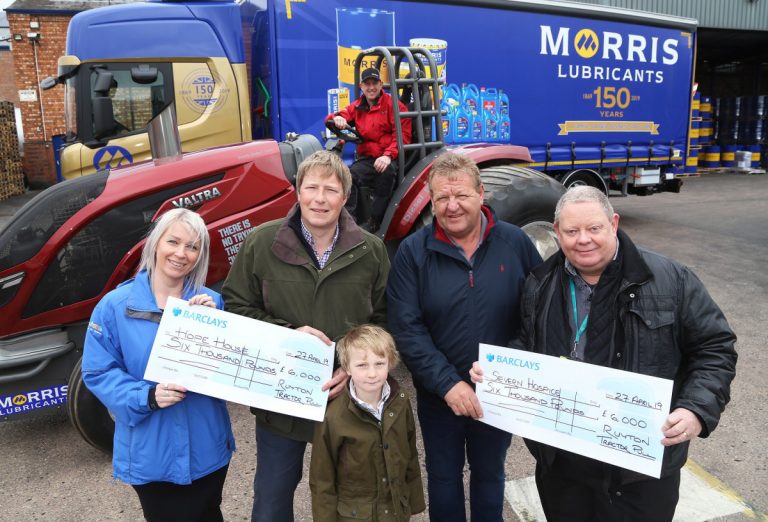 Lynsey Kilvert of Hope House, and Andy Perkins of Severn Hospice, receive the proceeds of the latest Ruyton X1 Towns charity tractor pull at Morris Lubricants. They are pictured with Andrew Goddard, Gary Penton, Gareth Jones, and six-year-old George Goddard