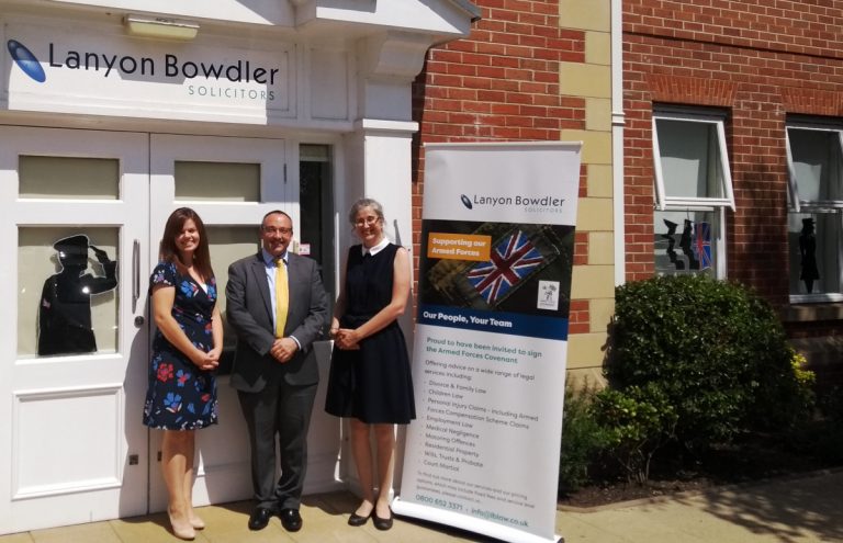 Military-themed window for Shropshire law firm