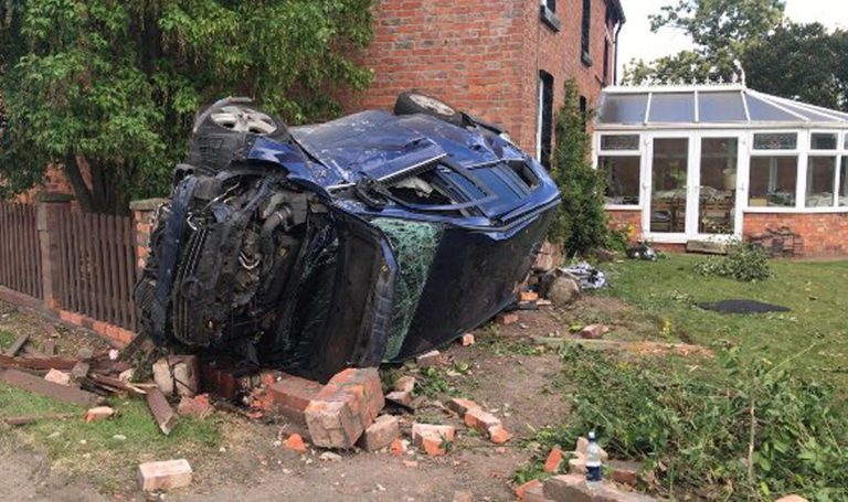 The vehicle ended up on its side in a garden. Photo: West Mercia Police