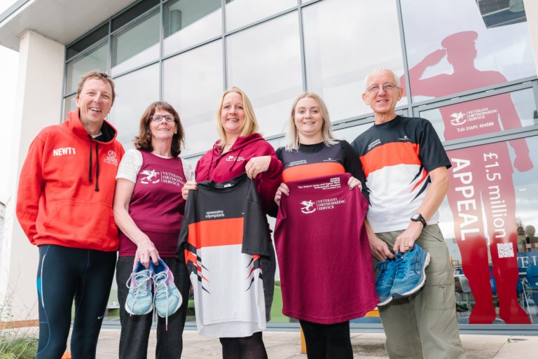 Members of The Marches School Oswestry 10k organising committee - Dave Newton, Ellen Harrison, Ashling Donohue-Harrison and Ray Pickett with Helen Knight, RJAH Fundraising Manager (centre)