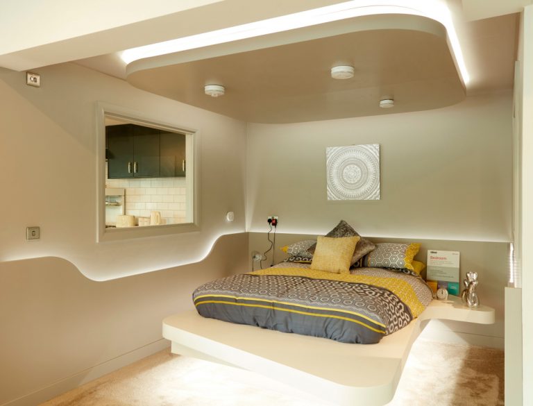 Aico’s futuristic bedroom with bed with two side tables and LED lighting made and fitted by Morris Joinery